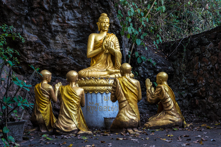 Buddhas along Cave on Holy Mountain Mount Phousi, Luang Prabang, Laos in Southeast Asiaの写真素材