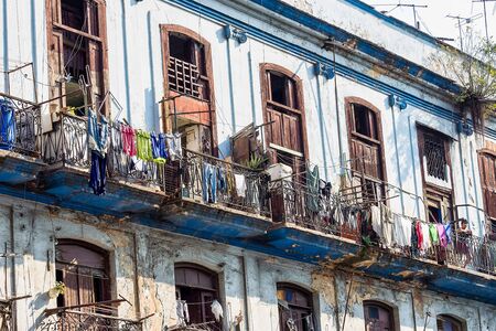 Old living colorful houses across the road in the center of Havana, Cubaの写真素材