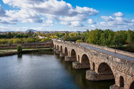 Merida, Spain - November 05, 2019: Historical Bridge, built by the Romans. It is the longest surviving Roman bridge, over the Guadiana River in Merida, Extremadura, Spain. Puente Romanoのeditorial素材