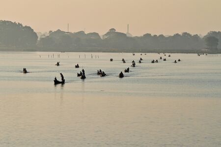 Mandalay, Myanmar - Nov 12, 2019: Fishermen near U Bein bridge in Amarapura,Mandalay Myanmarのeditorial素材
