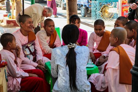 Mandalay, Myanmar - Nov 11, 2019: People in Mahamuni Pagoda in Mandalay, Myanmar former Burma. Mahamuni Pagoda is a Buddhist temple and major pilgrimage site in Myanmar.のeditorial素材