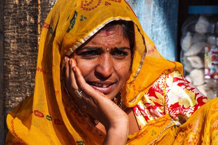 Jaisalmer, India - Dec 31, 2019: Rajasthani gypsy woman in traditional tribal attire and jewelryのeditorial素材
