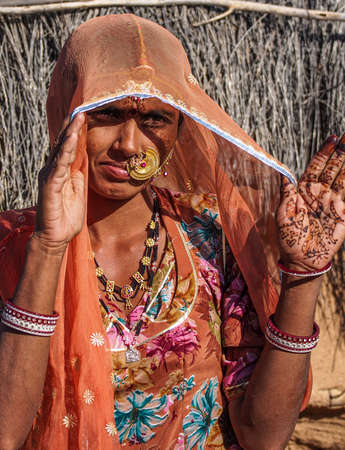 Jaisalmer, India - Jan 01, 2020: Rajasthani gypsy woman in traditional tribal attire and jewelry