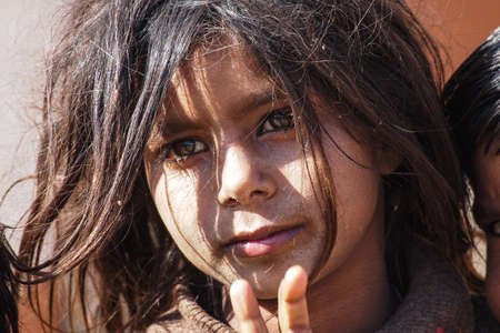 Jaisalmer, India - Dec 31, 2019: Rajasthani gypsy woman in traditional tribal attire and jewelry