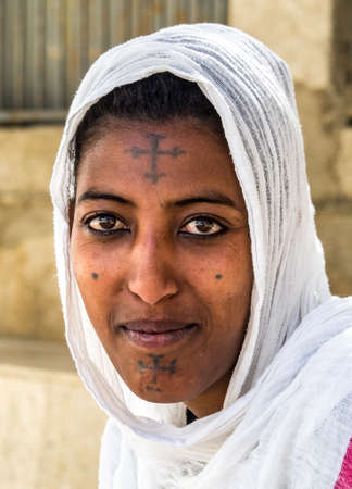 Aksum, Ethiopia - Feb 09, 2020: Ethiopian woman at Church of Our Lady St. Mary of Zion, the most sacred place for all Orthodox Ethiopians in Axum, Ethiopia.のeditorial素材