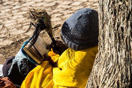 Aksum, Ethiopia - Feb 09, 2020: Orthodox beggar at Church in the Northern Stela Park of Aksum,...