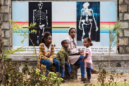 Addis Ababa, Ethiopia - Feb 04, 2020: Ethiopian family sitting in front of the national museum of Addis Ababa in Ethiopia, Africaのeditorial素材