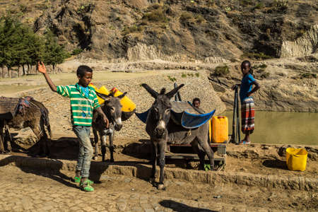 Aksum, Ethiopia - Feb 09, 2020: people at the ruins of the baths of the Queen of Saba, Africaのeditorial素材