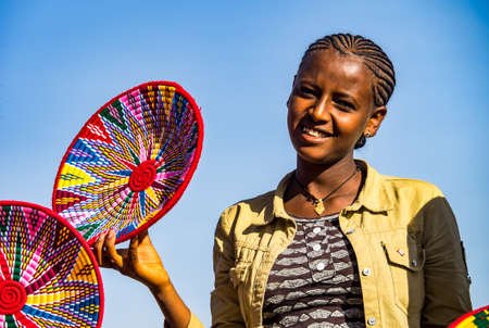 Aksum, Ethiopia - Feb 09, 2020: Ethiopian girls selling baskets in the Aksum basket market in Aksum,...