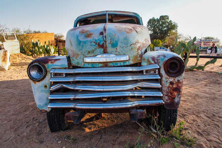 Solitaire, Namibia - Jul 12, 2019: Wrecked cars lie abandoned in the desert surrounding Solitaire in Namibia.のeditorial素材