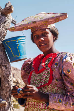 Twyfelfontein, Namibia - Jul 10, 2019: Herero Woman in traditional clothes in Twyfelfontein....
