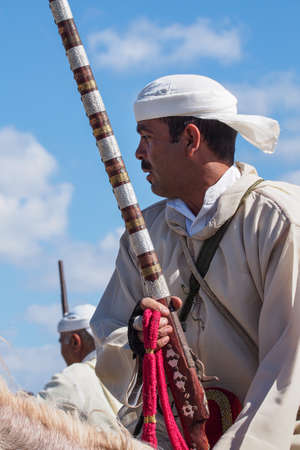 Rabat, Morocco - Oct 13, 2019: Local equestrians participate in a traditional fantasia event or MOUSSEM TBOURIDA in Arabic and wearing a traditional Moroccan dress and accessoriesのeditorial素材