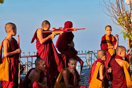 Kyaiktiyo, Myanmar - Nov 04, 2019: Monks at Kyaiktiyo Pagoda also known as Golden Rock is a...