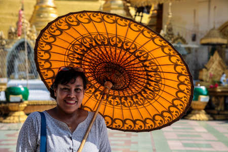 Mawlamyine, Myanmar - Nov 05, 2019: Woman at Kyaik Tan Lan or Kyaikthanlan Pagoda in Mawlamyine or Moulmein, Mon State, Myanmarのeditorial素材