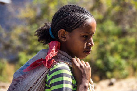 Aksum, Ethiopia - Feb 08, 2020: Ethiopian people on the road from Axum to the Simien mountains, North Ethiopia, Africa.のeditorial素材