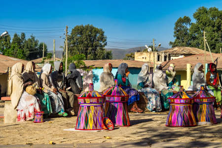 Aksum, Ethiopia - Feb 10, 2020: Ethiopian women selling baskets in the Aksum basket market in Aksum, Ethiopia.のeditorial素材