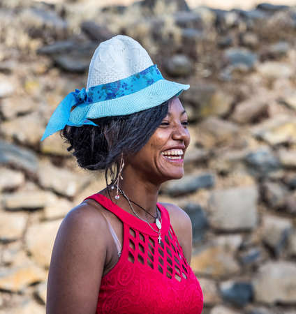 Gondar, Ethiopia - Feb 06, 2020: Young girl poses for a portrait taken at Fasil Ghebbi, the remains of a fortress-city within Gondar, Ethiopia in Africaのeditorial素材