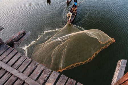 Mandalay, Myanmar - Nov 12, 2019: Fishermen near U Bein bridge in Amarapura,Mandalay Myanmarのeditorial素材
