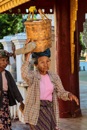 Bagan, Myanmar - Nov 14, 2019: Burmese people in the golden Shwezigon Pagoda or Shwezigon Paya in Bagan, Myanmar former Burma in Asiaのeditorial素材