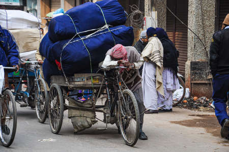 Varanasi, India - Dec 24, 2019: People in the crowded streets of Varanasi. Traffic scene