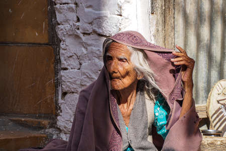 Jaisalmer, India - Dec 31, 2019: Indian Rajasthani old woman in national clothes in the streets of Jaisalmer, Rajasthanのeditorial素材