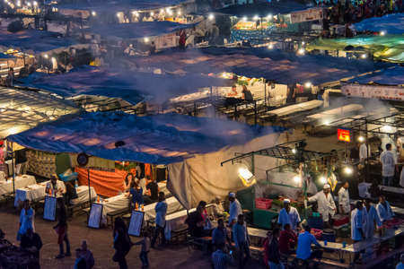 Marrakesh, Morocco - Oct 21, 2019: Jemaa el Fna market square with Koutoubia mosque, Marrakesh, Morocco, north Africa. Jemaa el-Fnaa, is a famous square and market place in Marrakesh's medinaのeditorial素材