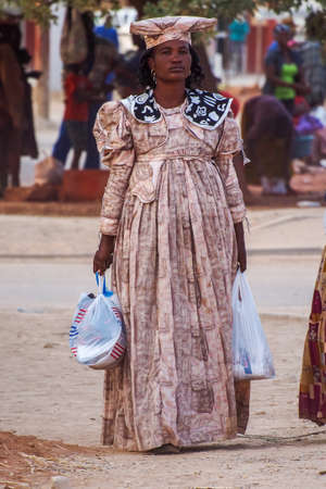 Opuwo, Namibia - Jul 06, 2019: Herero Woman in traditional clothes in Opuwo. Namibia. The Herero belonging to the Bantu group, with about 240,000 members alive today.のeditorial素材