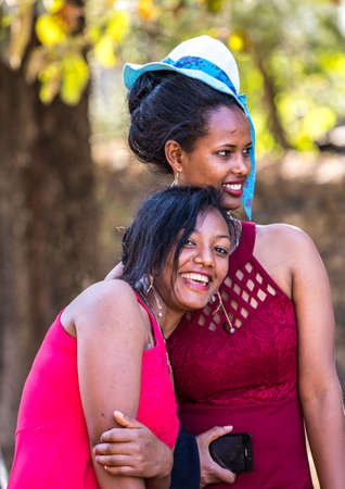 Gondar, Ethiopia - Feb 06, 2020: Young girls pose for a portrait taken at Fasil Ghebbi, the remains of a fortress-city within Gondar, Ethiopia in Africaのeditorial素材