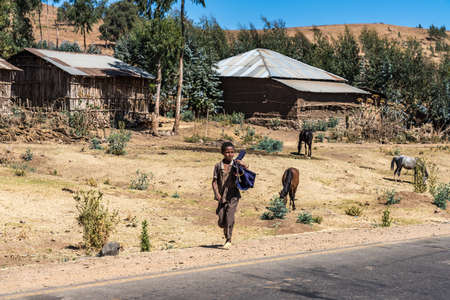 Gondar, Ethiopia - Feb 07, 2020: Ethiopian people on the road from Gondar to the Simien mountains, North Ethiopia, Africa.のeditorial素材