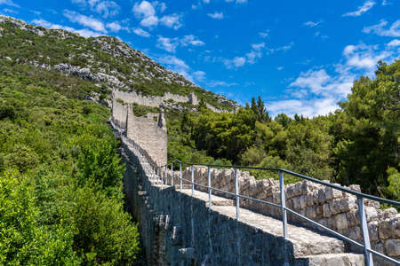 The second longest city wall in the world after the Great Wall of China. One of the major tourist attractions in Southern Croatia. Ston small town near Dubrovnik with old salt pans still in use.の写真素材