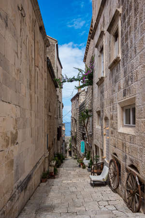 Narrow street in Korcula old town, Croatia. Korcula is a historic fortified town on the protected east coast of the island of Korculaの写真素材