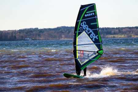 Starnberg, Germany - Sep 19, 2019: Surfer at Lake Starnbeger in Upper Bavaria, Germany