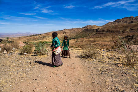 Lalibela, Ethiopia - Feb 12, 2020: Ethiopian children seen on the road from Lalibela to Gheralta,...