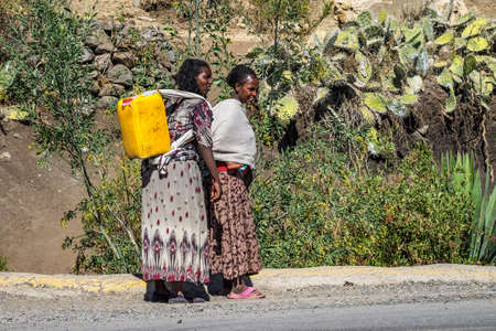 Lalibela, Ethiopia - Feb 12, 2020: Ethiopian women seen on the road from Lalibela to Gheralta, Tigray in Northern Ethiopia, Africaのeditorial素材