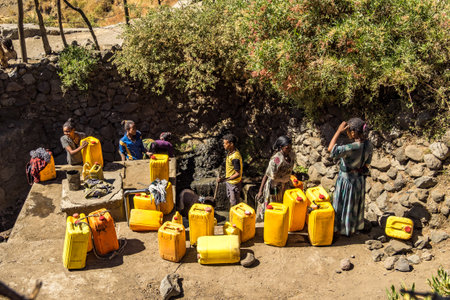 Lalibela, Ethiopia - Feb 14, 2020: People getting water at a water point in lalibela, ethiopia....