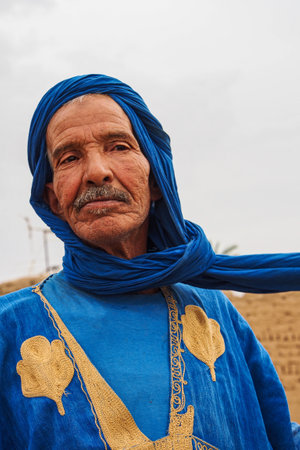 Erfoud, Morocco - Oct 17, 2019: Old Berber man living in the moroccan mountains in Ksar Maadid near...
