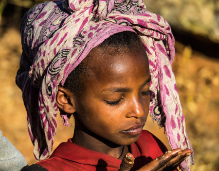 Aksum, Ethiopia - Feb 08, 2020: Ethiopian girl on the road from Axum to the Simien mountains, North Ethiopia, Africa.のeditorial素材