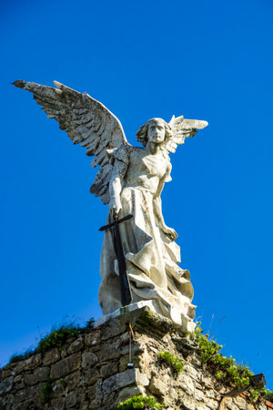 Sculpture of a Guardian angel with a sword in the cemetery of Comillas. Cantabria in Spainの写真素材