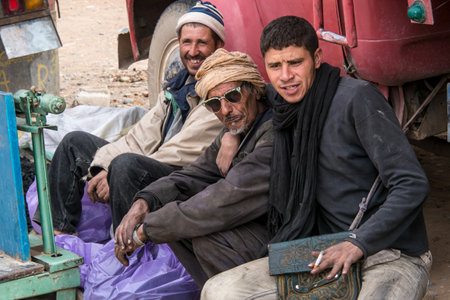 Erfoud, Morocco - Oct 19, 2019: local residents at the Road of a Thousand Kasbahs in their...
