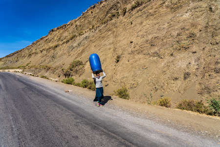 Lalibela, Ethiopia - Feb 12, 2020: Ethiopian woman seen on the road from Lalibela to Gheralta, Tigray in Northern Ethiopia, Africaのeditorial素材