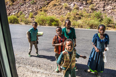 Lalibela, Ethiopia - Feb 12, 2020: Ethiopian children seen on the road from Lalibela to Gheralta, Tigray in Northern Ethiopia, Africaのeditorial素材