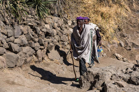 Lalibela, Ethiopia - Feb 14, 2020: Ethiopian people at the famous Monastery Neakuto Leab near Lalibela, Ethiopia, Africaのeditorial素材