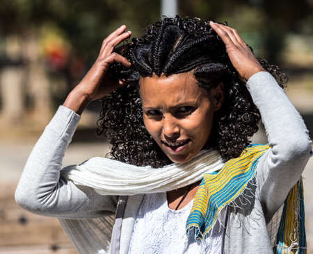 Aksum, Ethiopia - Feb 09, 2020: Ethiopian woman at Church of Our Lady St. Mary of Zion, the most sacred place for all Orthodox Ethiopians in Axum, Ethiopia.のeditorial素材