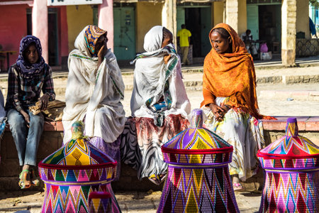 Aksum, Ethiopia - Feb 10, 2020: Ethiopian women selling baskets in the Aksum basket market in Aksum, Ethiopia.のeditorial素材