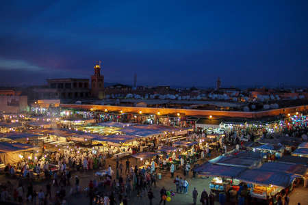 Marrakesh, Morocco - Oct 21, 2019: Jemaa el Fna market square with Koutoubia mosque, Marrakesh,...
