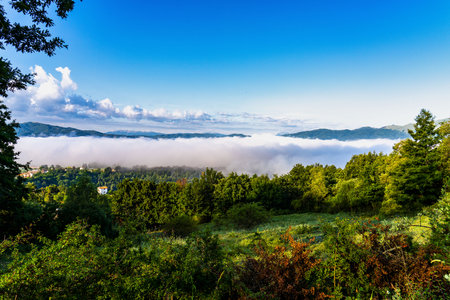 Foggy morning view from the hills of San Capone to the Sibillini mountains park in Italy, Europe
