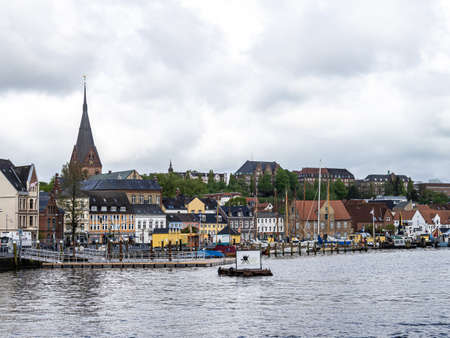 Sail boats in the port of Flensburg, St. Jorgen's Church in the background. Schleswig-Holstein in Germany, Europeの写真素材