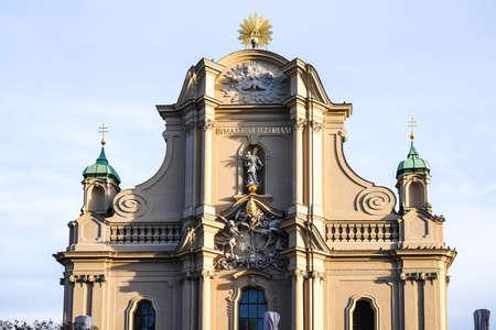 Facade of the Heiliggeistkirche, Heilig Geist Kirche, Church of the Holy Spirit in downtown of Munich, between Marienplatz and the Viktualienmarkt, in rococo and gothic style. Germanyの写真素材