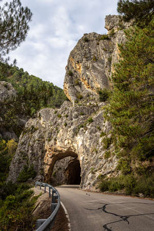 Tunnel hole at Serrania de Cuenca near Cuenca and Fuertescusa. Door to hell, Puerta del Infierno, Tuneles excavados en roca del Rio Escabas, Spain Europe.の写真素材