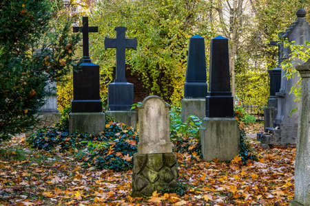 View of famous Old North Cemetery of Munich, Germany with historic gravestones. Funerals have not been held here since 1944. Instead, the cemetery is used as a park.の写真素材